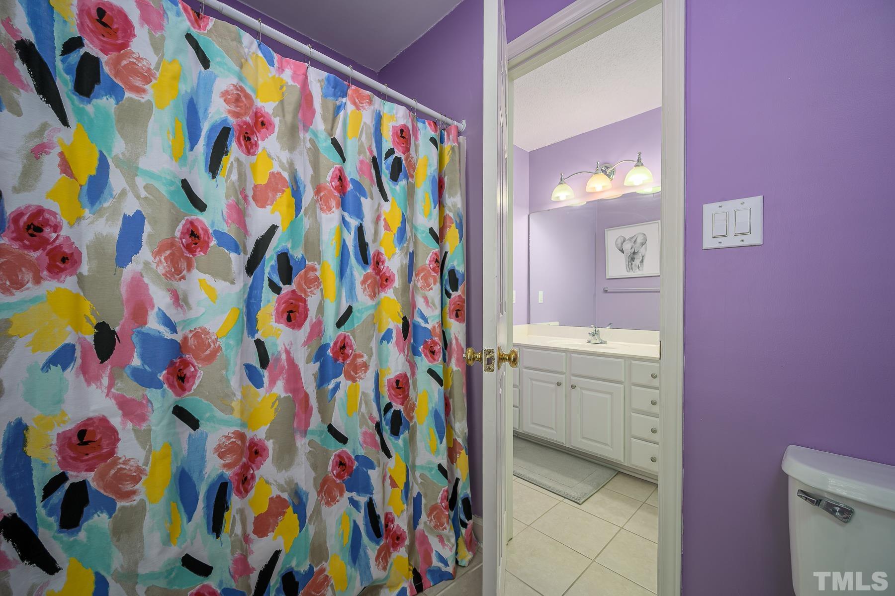 701 Modena Drive Cary, NC 27513 - Photo 32 of 39 a bathroom with a vanity and a bath tub