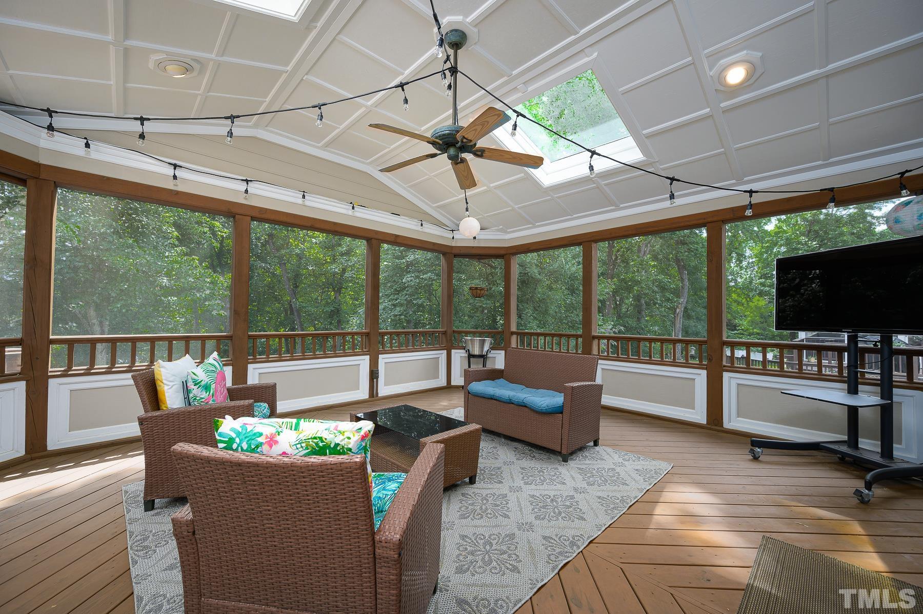 701 Modena Drive Cary, NC 27513 - Photo 33 of 39 a living room with furniture and a flat screen tv