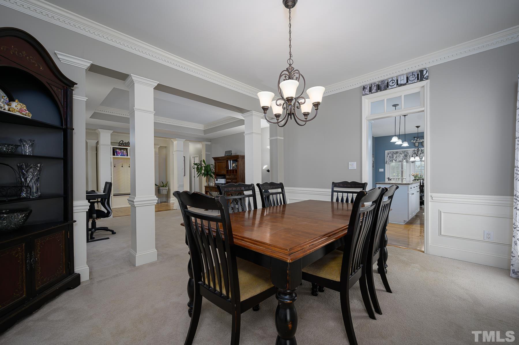 701 Modena Drive Cary, NC 27513 - Photo 9 of 39 a view of a dining room and chandelier