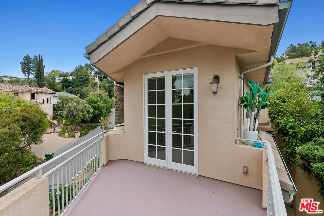 23550 Valley View Road Calabasas, CA 91302 - Photo 15 of 26 a view of a house with porch and windows