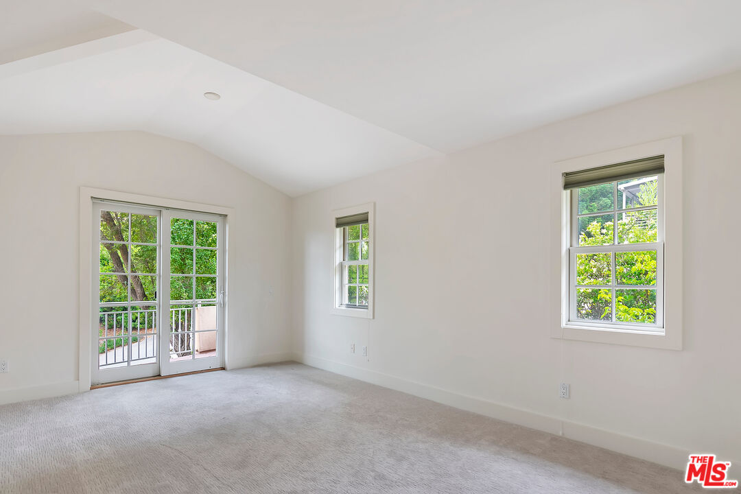 23550 Valley View Road Calabasas, CA 91302 - Photo 18 of 26 an empty room with windows