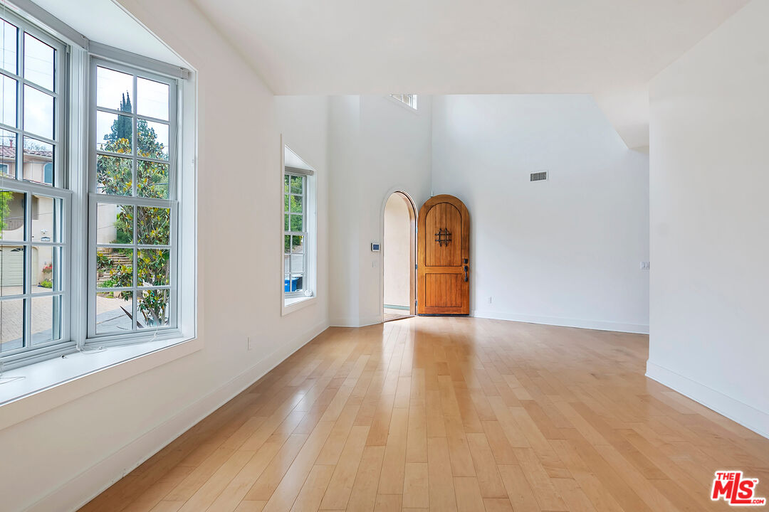 23550 Valley View Road Calabasas, CA 91302 - Photo 2 of 26 a view of empty room with wooden floor and fan