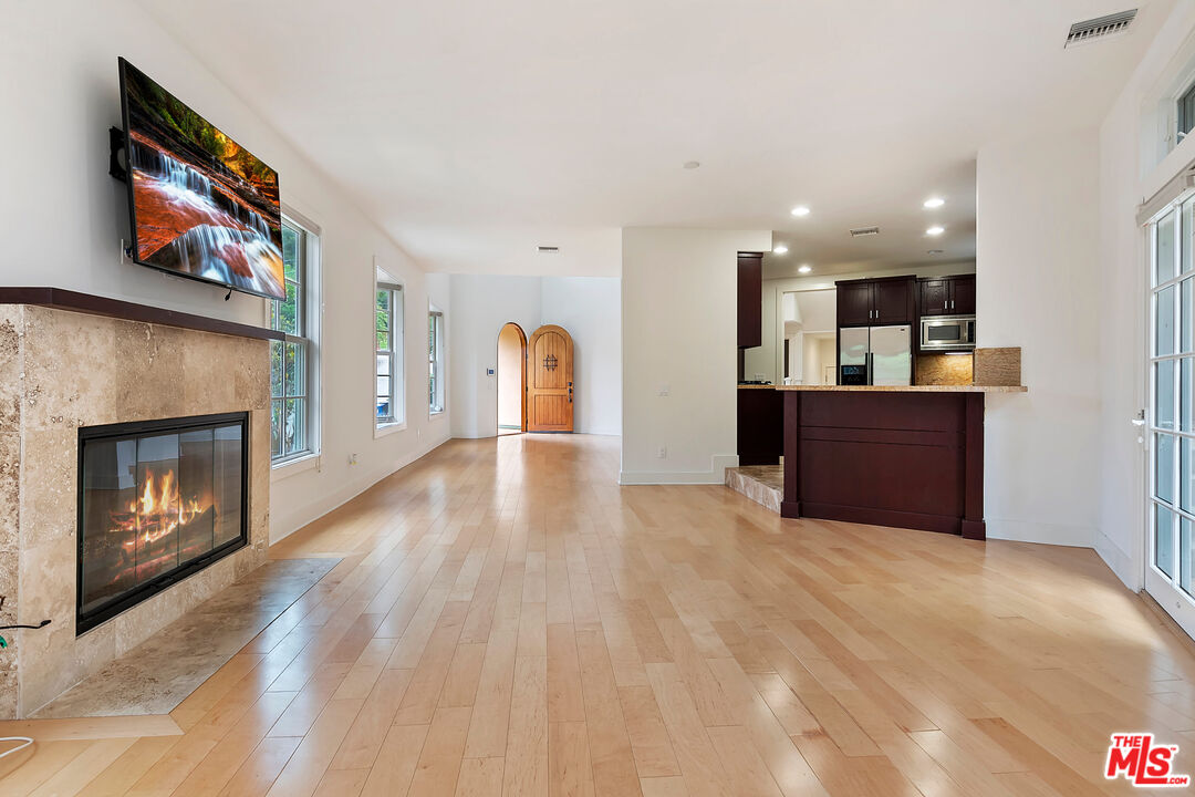 23550 Valley View Road Calabasas, CA 91302 - Photo 4 of 26 a view of a kitchen with furniture and fireplace