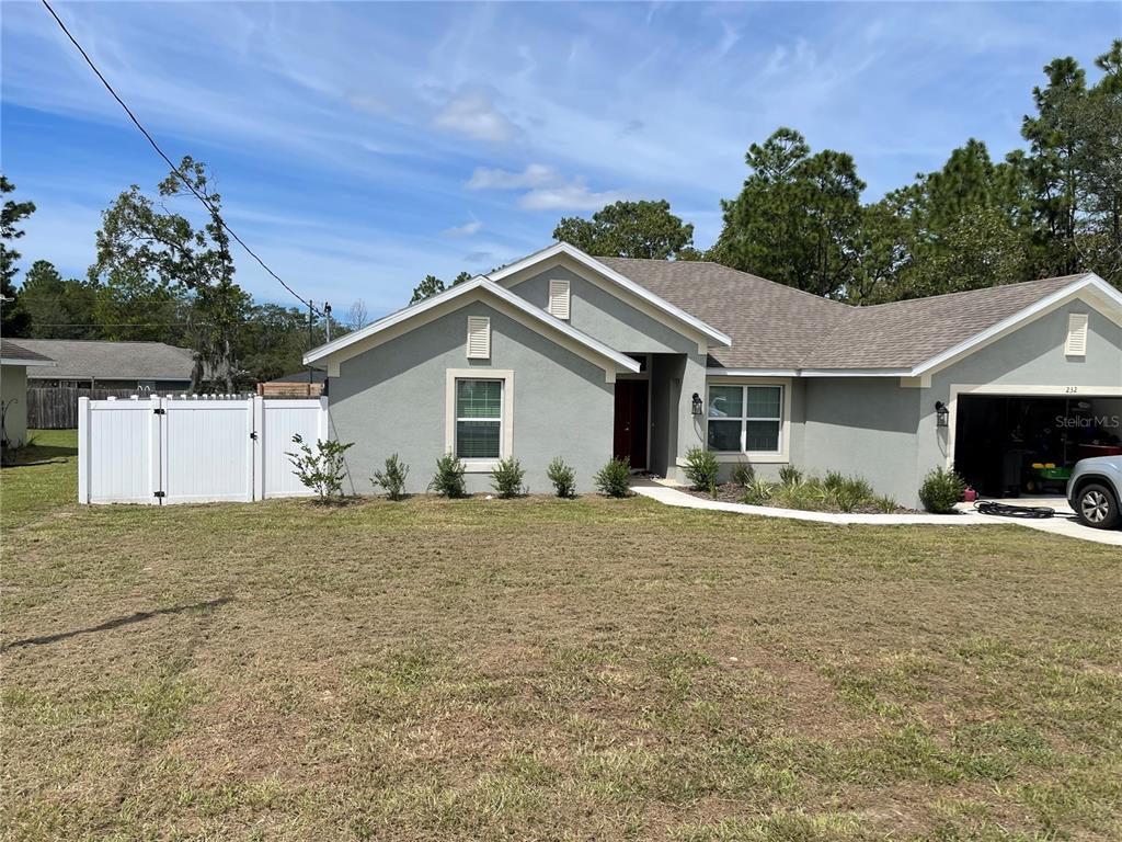 232 Locust Pass Course Ocala, FL 34472 - Photo 1 of 1 a house with yard in front of it