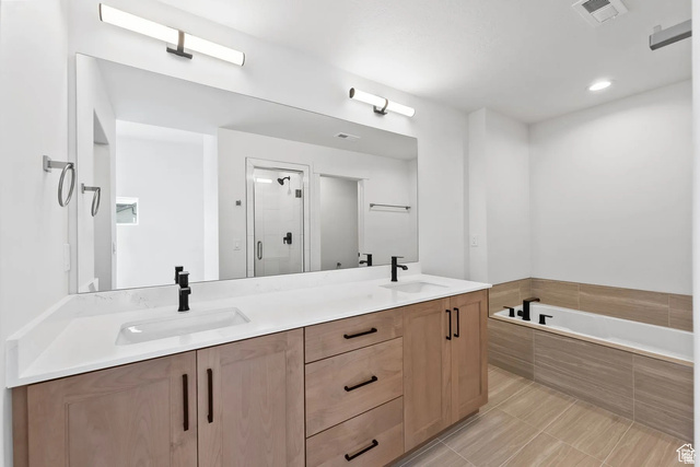 545 East 7215 South Midvale, UT 84047 - Photo 16 of 27 Full bathroom featuring double vanity, a shower stall, a bath, recessed lighting, and light tile patterned floors