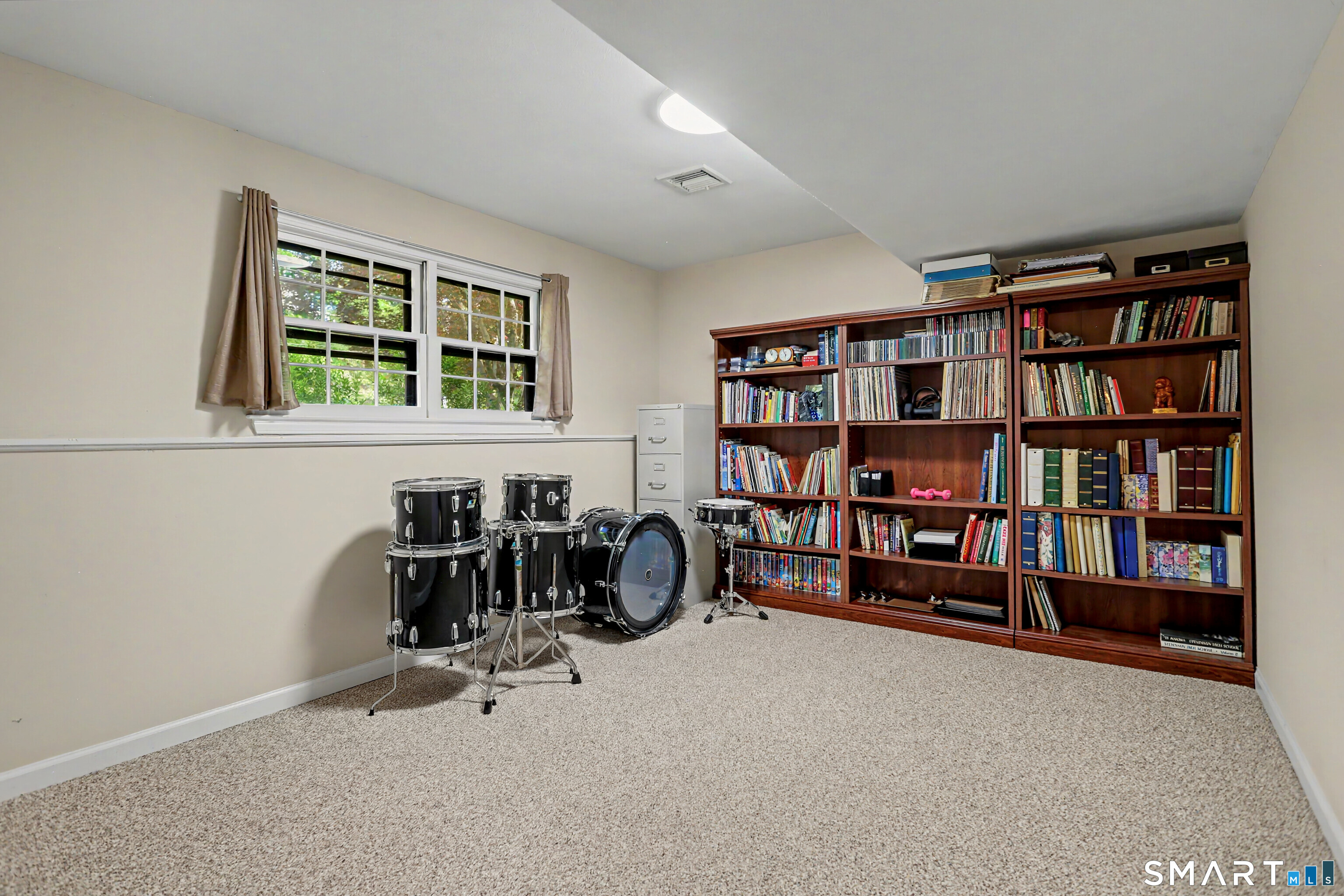 632 Wheelers Farm Road Orange, CT 06477 - Photo 26 of 39 a livingroom with a large window and a couch