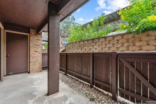 a wooden door in front of a house