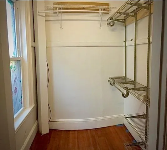 a bathroom with a glass shower door