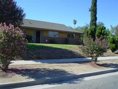 10121 Hedrick Riverside, CA 92503 - Photo 1 of 1 a front view of a house with garden