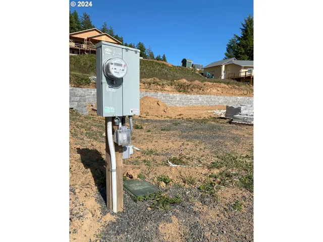 a view of a road with a building in the background