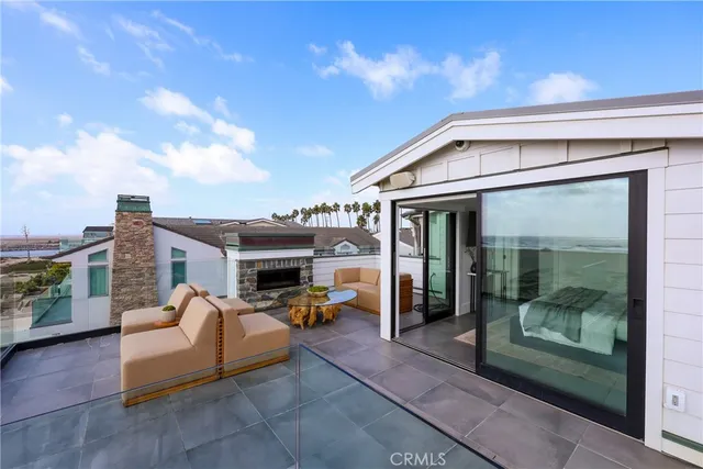 a bedroom with furniture and large window