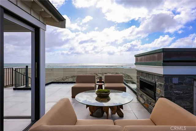 a outdoor space with patio the couches and a fireplace