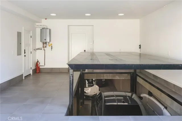 a kitchen with a sink a refrigerator and a stove