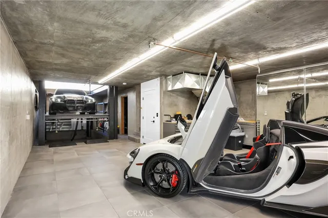 a view of a garage with parked cars