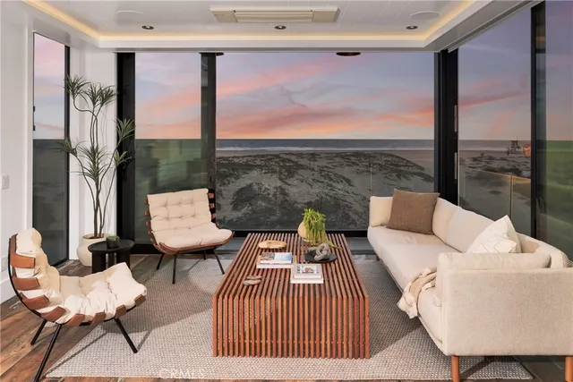 a outdoor living space with furniture and a floor to ceiling window