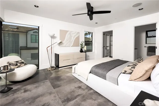 a bedroom with a bed and window