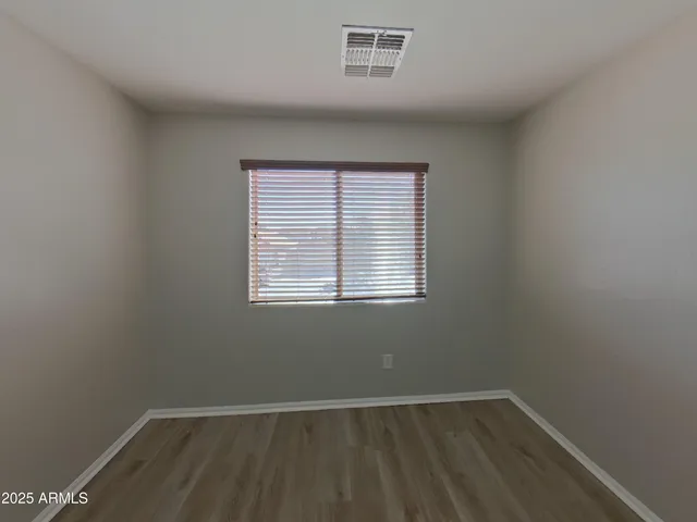 a spacious bathroom with a bathtub sink and mirror
