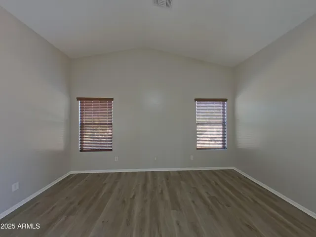 a kitchen with refrigerator and microwave