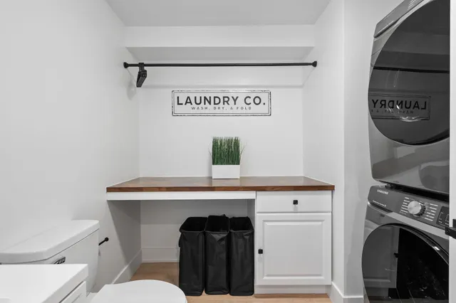 a view of a hallway with washer and dryer
