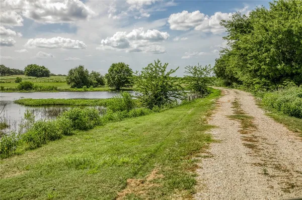 a view of a lake with a big yard