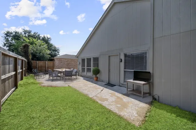 a view of empty room with fireplace and windows