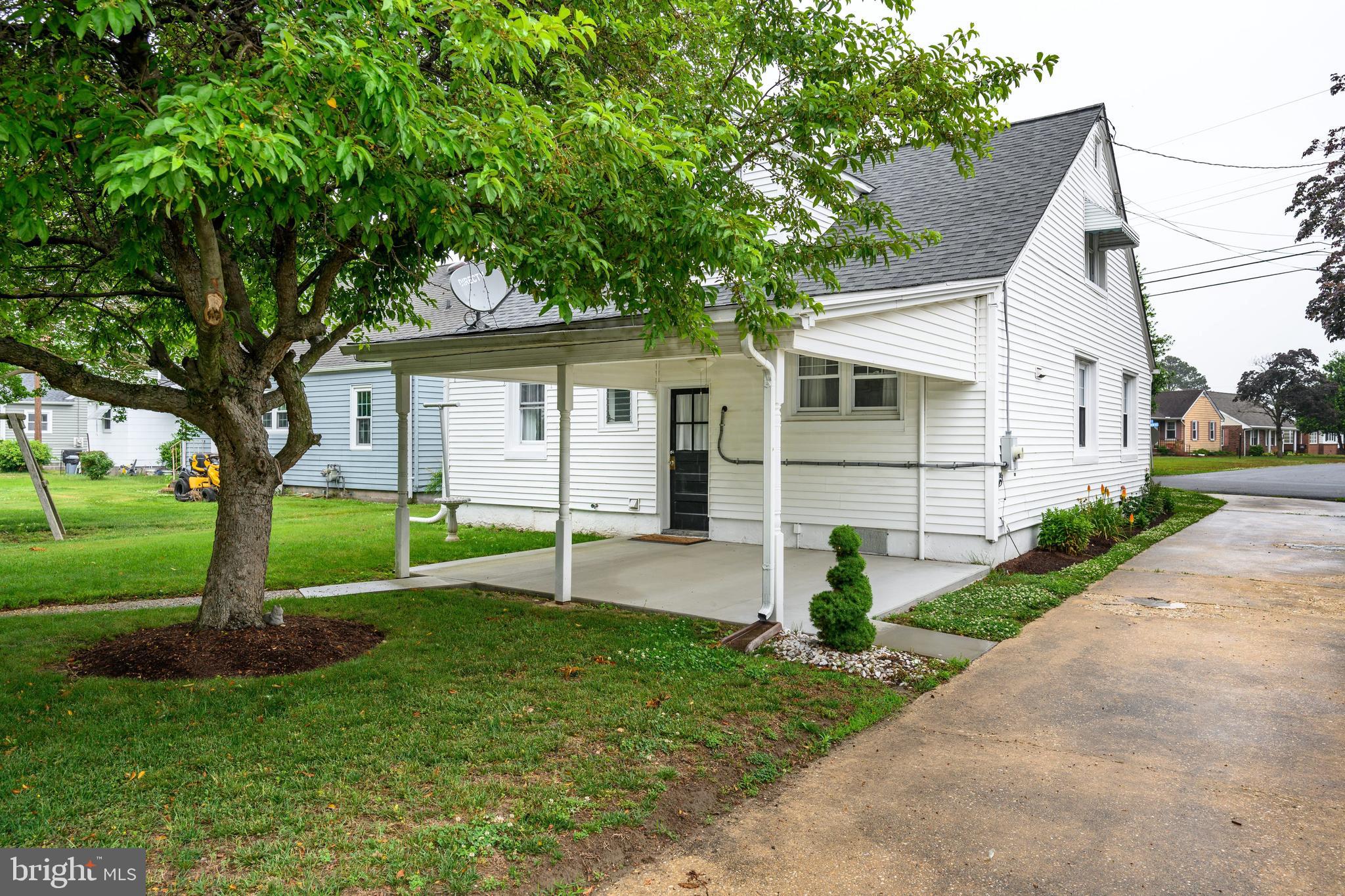 207 Crusader Road Cambridge, MD 21613 - Photo 66 of 76 a front view of house with yard and green space