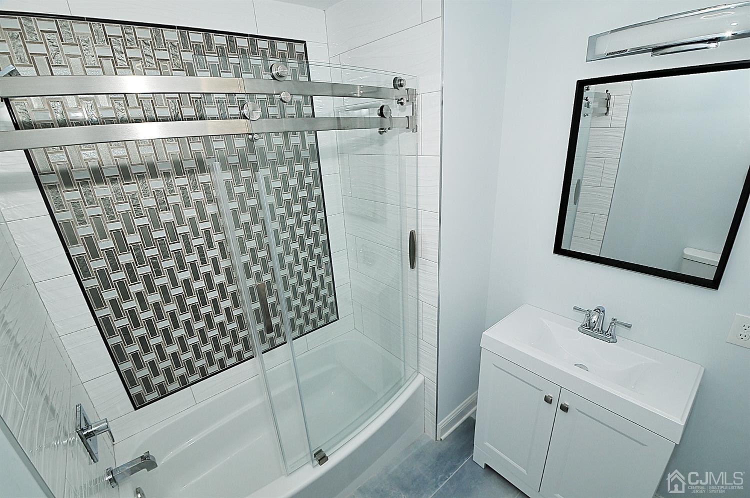24 Prescott Street Edison, NJ 08817 - Photo 15 of 27 a bathroom with a shower and a sink