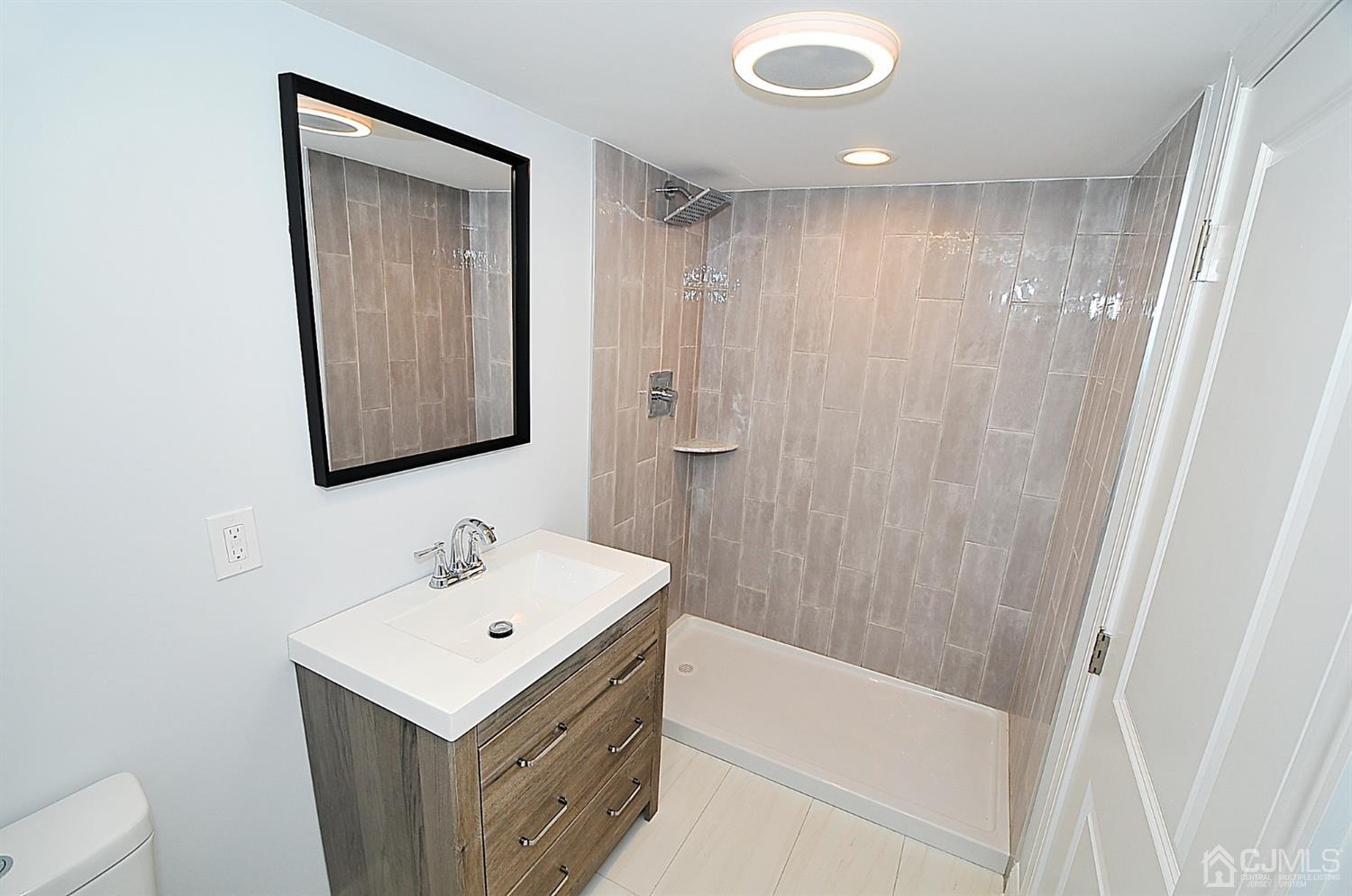 24 Prescott Street Edison, NJ 08817 - Photo 24 of 27 a bathroom with a sink a toilet and shower