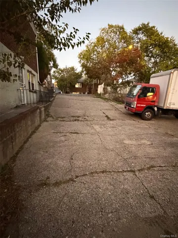 a view of car parked on the side of the road