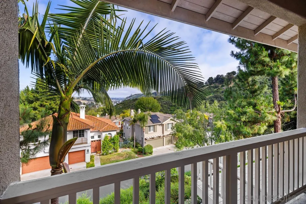 6013 Oakgate Row La Jolla, CA 92037 - Photo 25 of 50 a view of a palm plant from a balcony