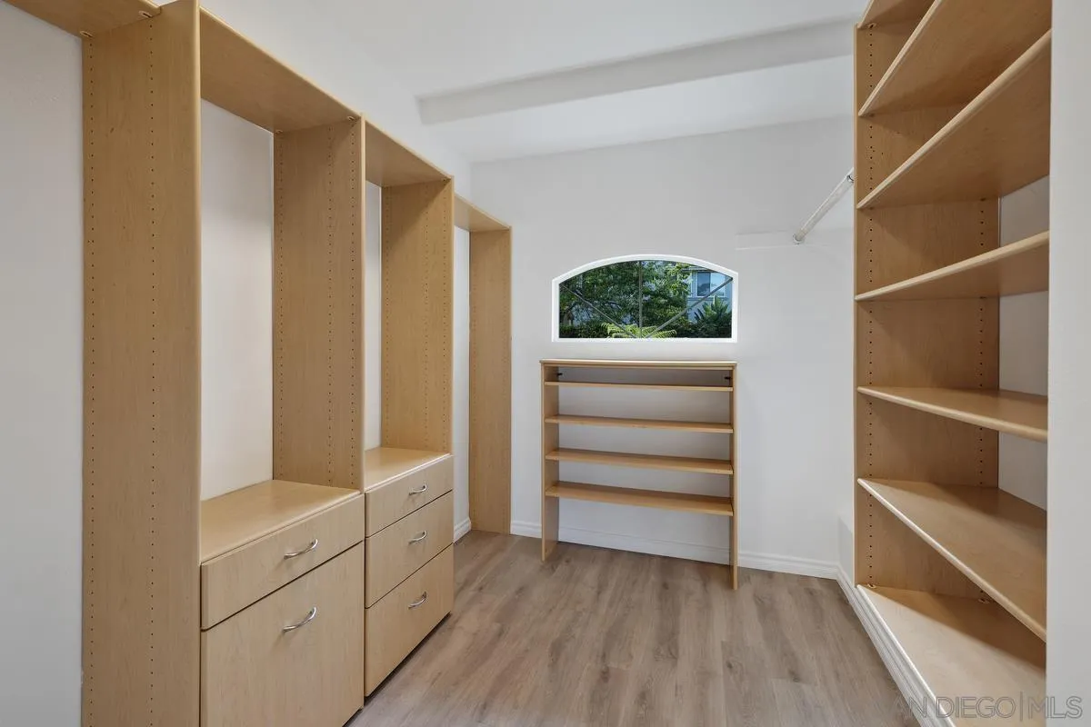 6013 Oakgate Row La Jolla, CA 92037 - Photo 31 of 50 a view of walk in closet with empty racks