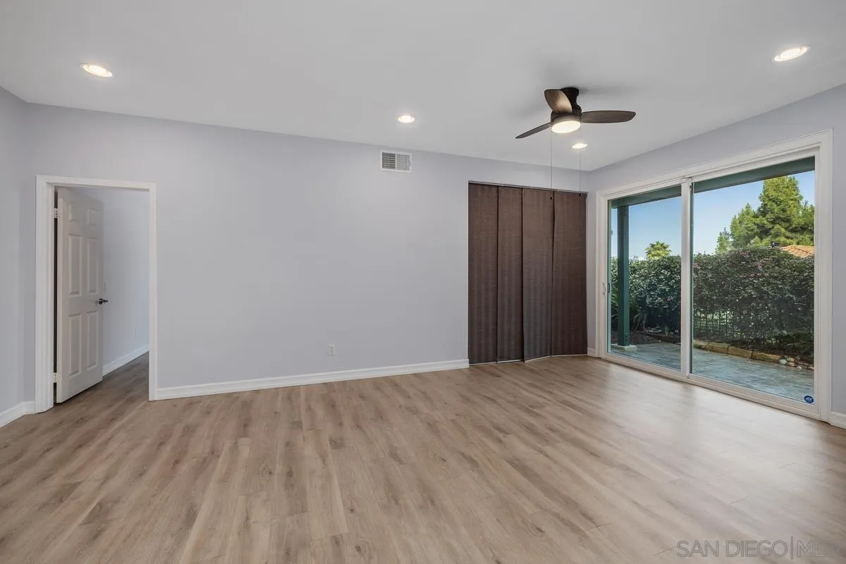 6013 Oakgate Row La Jolla, CA 92037 - Photo 32 of 50 wooden floor in an empty room with a window