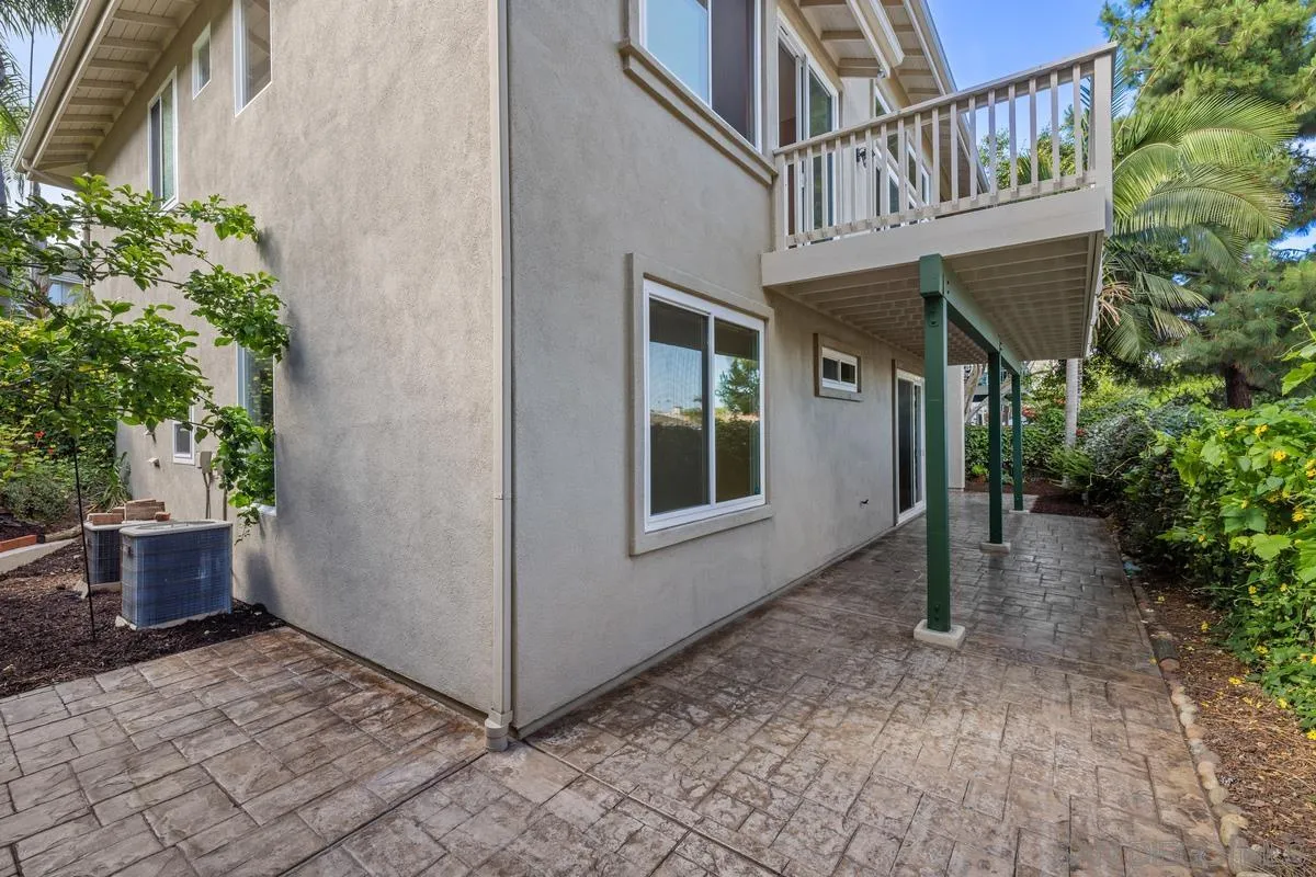 6013 Oakgate Row La Jolla, CA 92037 - Photo 39 of 50 a view of a house with backyard and sitting area