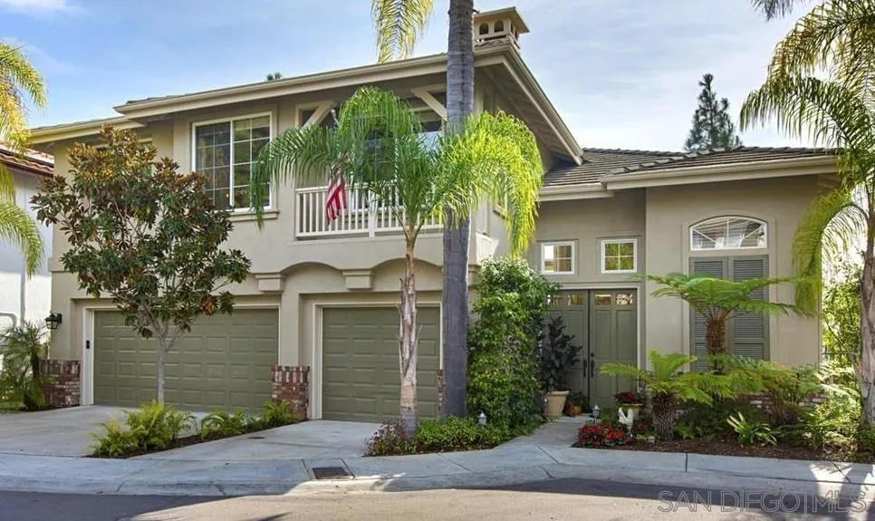 6013 Oakgate Row La Jolla, CA 92037 - Photo 4 of 50 a front view of a house with garden