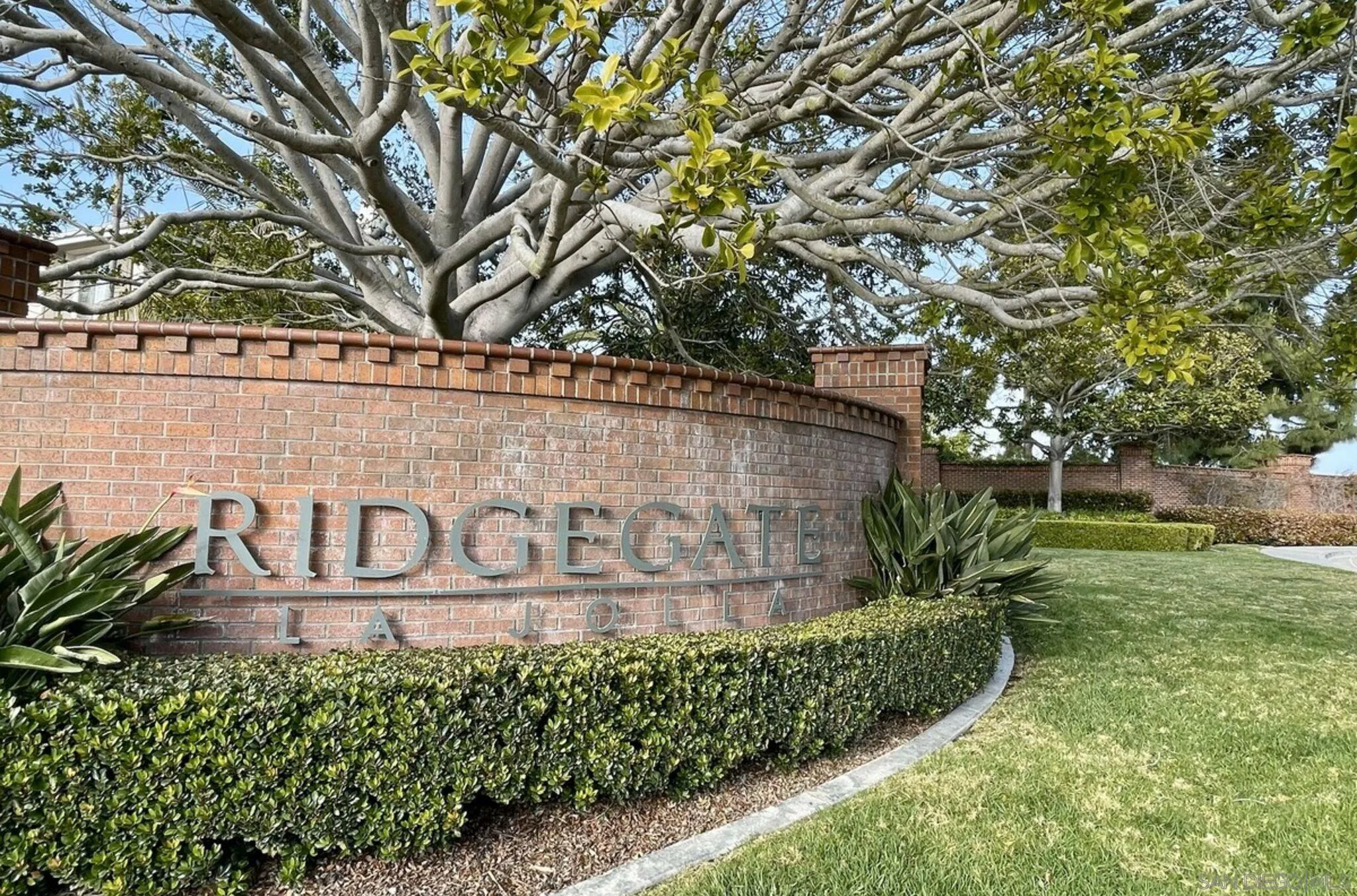 6013 Oakgate Row La Jolla, CA 92037 - Photo 50 of 50 a view of sign board with a yard
