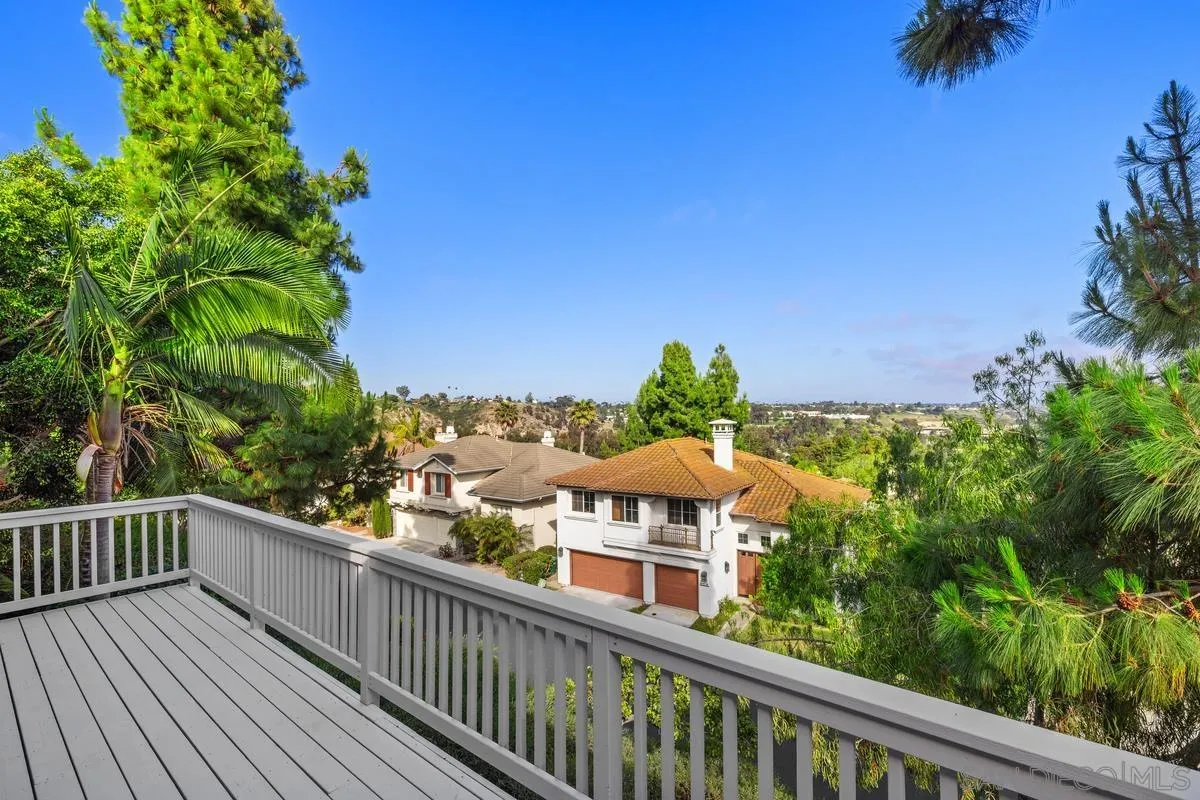 6013 Oakgate Row La Jolla, CA 92037 - Photo 5 of 50 a view of a balcony with wooden fence and floor