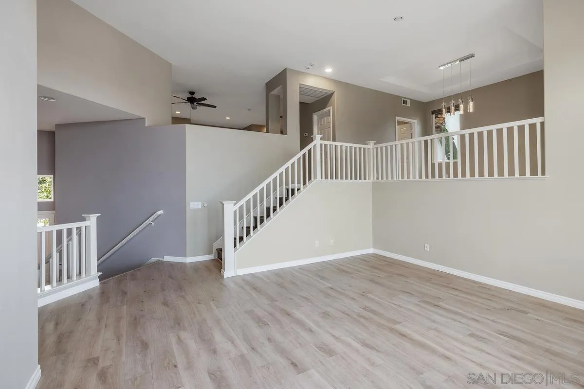 6013 Oakgate Row La Jolla, CA 92037 - Photo 8 of 50 a view of an entryway with wooden floor