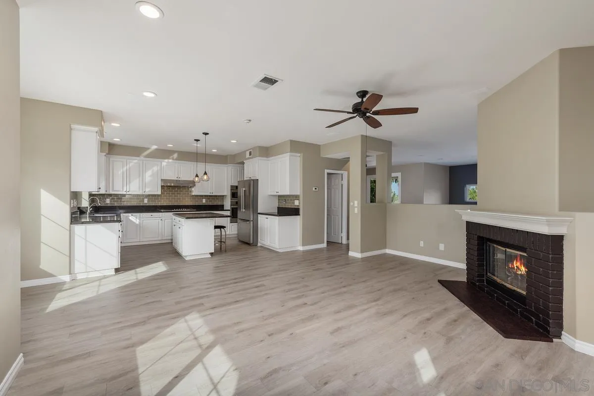 6013 Oakgate Row La Jolla, CA 92037 - Photo 10 of 50 a view of kitchen with refrigerator and window