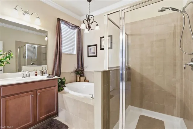 a bathroom with a double vanity sink mirror and shower