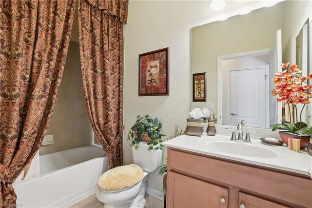 a bathroom with a sink toilet and a bathtub