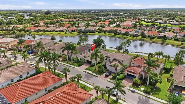 an aerial view of residential houses with outdoor space and swimming pool