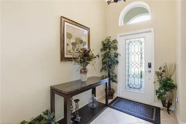 a view of entryway with paintings on the wall