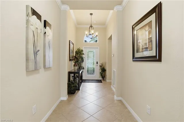 a hallway with a flower pot and a window
