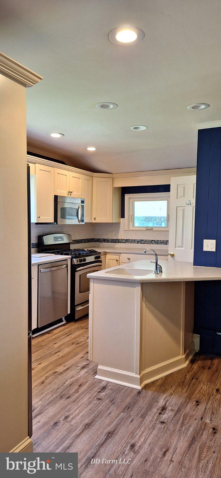 231 West Pine Street Georgetown, DE 19947 - Photo 18 of 26 Modern kitchen with sleek finishes.