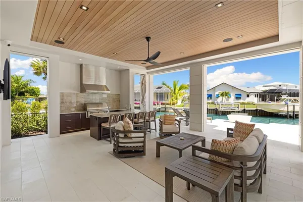a living room with furniture a fireplace and a window