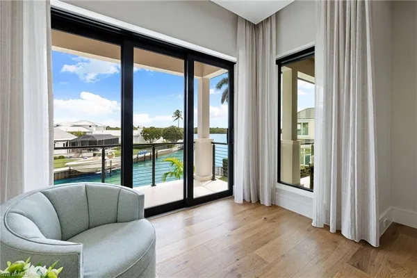 a living room with furniture and windows