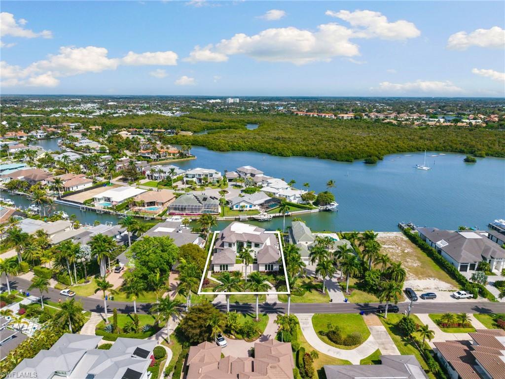 2345 Tarpon Road Naples, FL 34102 - Photo 41 of 43 an aerial view of a house with a lake view