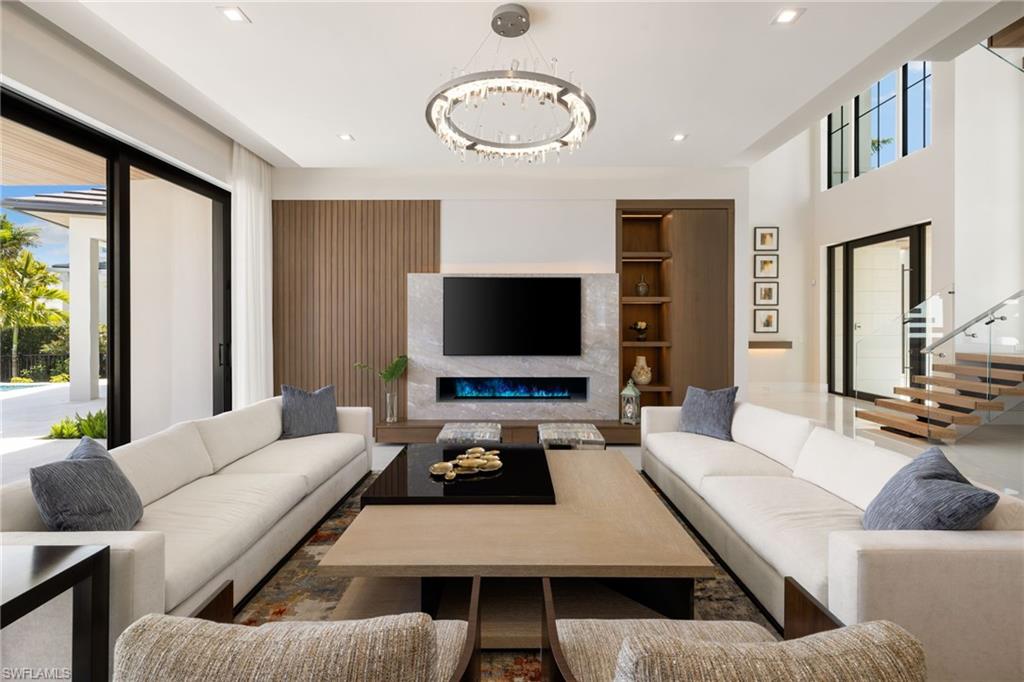 2345 Tarpon Road Naples, FL 34102 - Photo 6 of 43 a living room with furniture and a flat screen tv