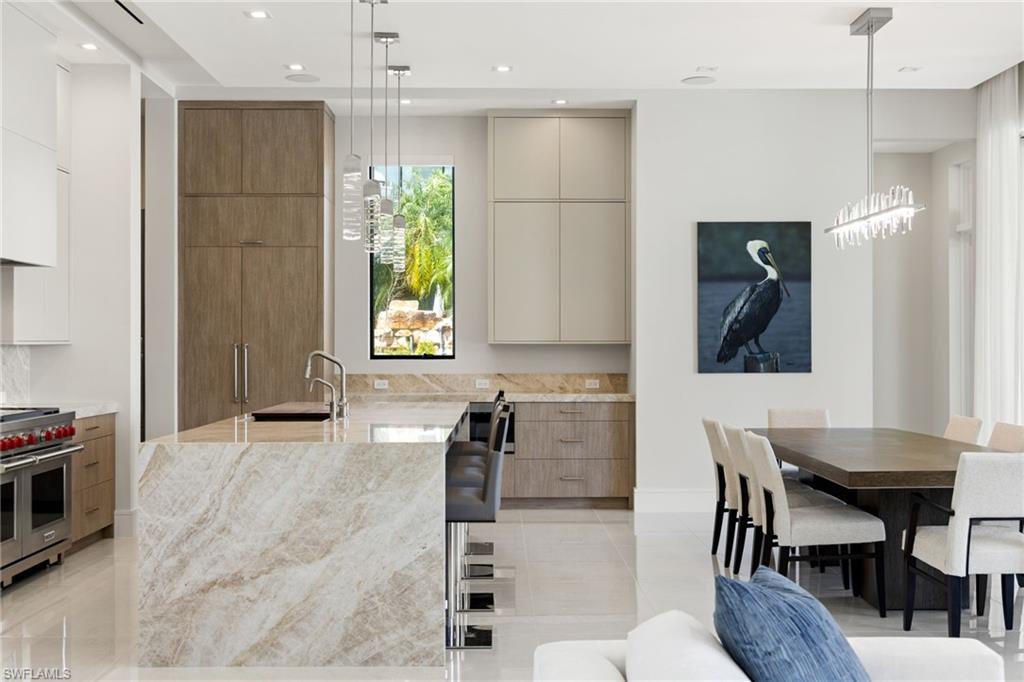 2345 Tarpon Road Naples, FL 34102 - Photo 10 of 43 a dining room with furniture and window