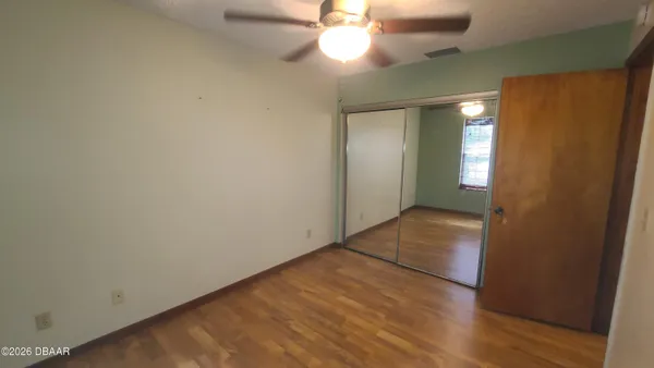 a view of a chandelier fan in a room